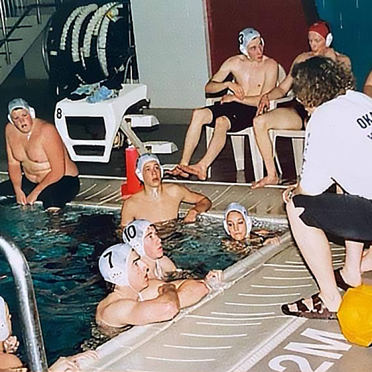 Coach Terril Ashton & the circa 2000 Okanagan Water Polo Team. #7 Pete Wilkins from Salmon Arm, #10 Mike Wilmink from Summerland, Red Cap - Marcus Krieger, #3 James Toivonen, Top Left - Casey Volden, #11 Maria Watson