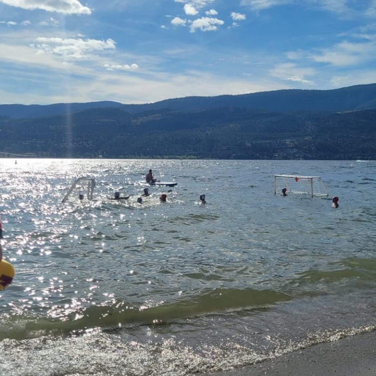 Summer Water Polo Swim Lessons for Youth and Adults at Tugboat Beach in Waterfront Park, Kelowna. During July and August each summer the water polo swim club runs practices and camps in the lake. Normally by this date the water temperature is around 22c a